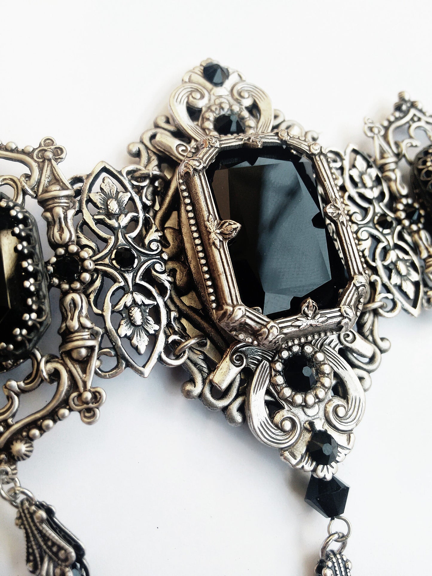 Macro shot of Grand Gothic Choker Set-Silver and Austrian Crystals highlighting central black crystal and ornate silver filigree.