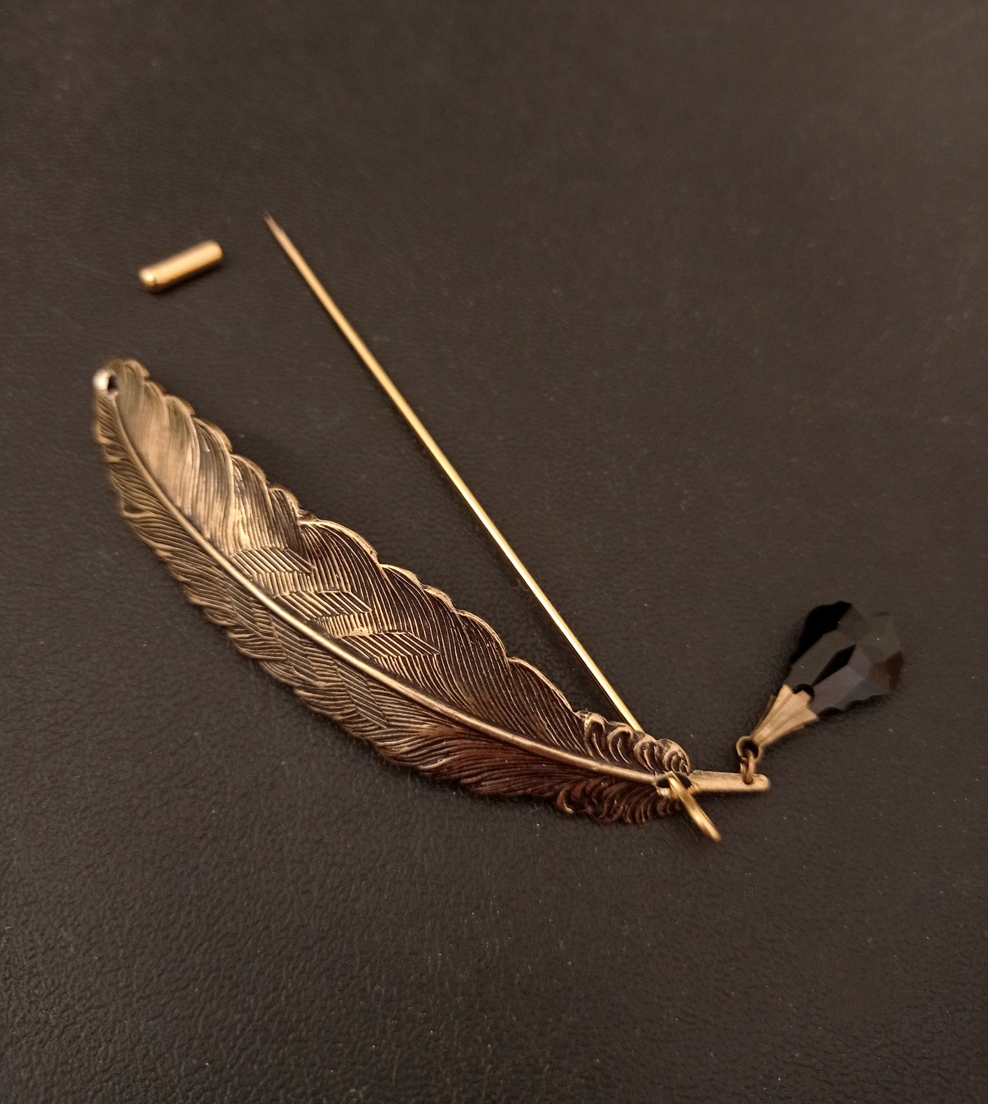 Brass quill brooch pin with black crystal "ink" drop.