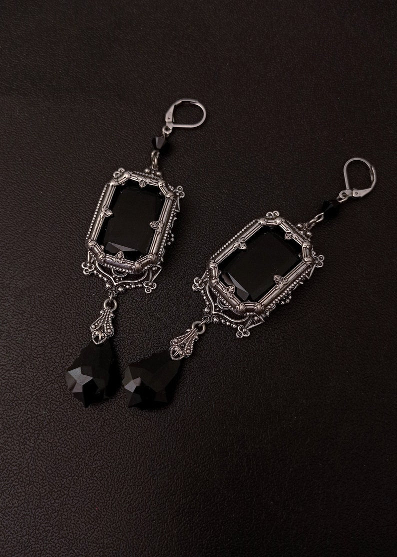 Pair of earrings from Grand Gothic Choker Set-Silver and Austrian Crystals with black faceted drops and detailed silver filigree.