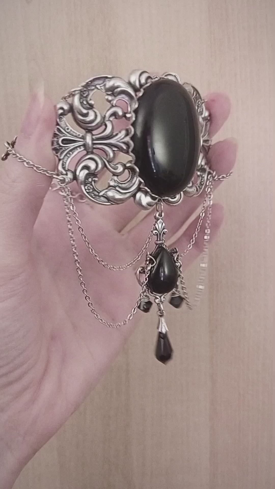 Silver choker with large black onyx cabochon and black crystal drops.