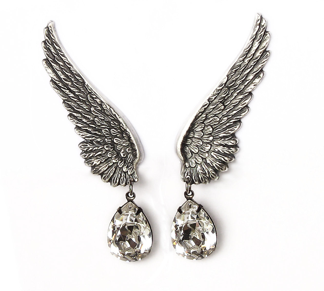 Elegant silver earrings designed as delicate wings with crystal drops, exuding a sense of grace and sophistication.