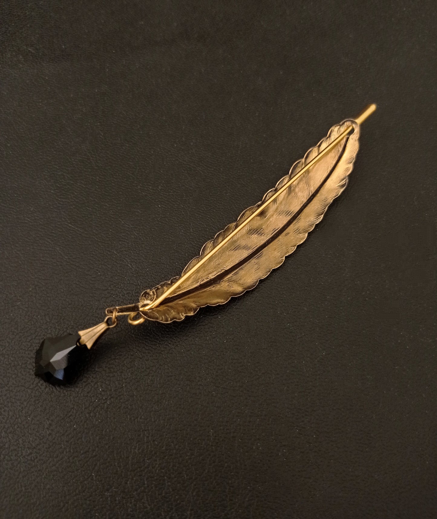 Brass quill brooch