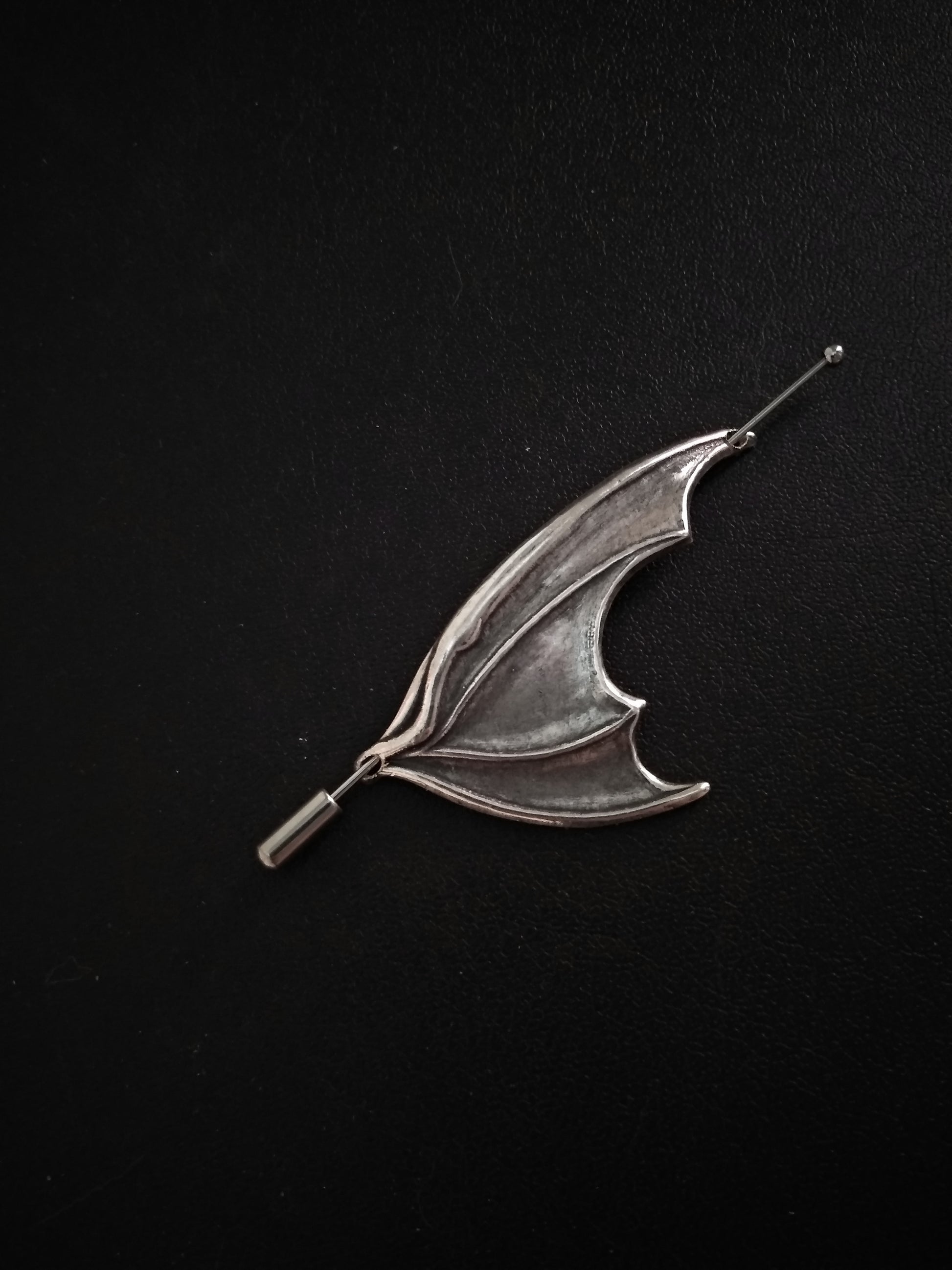 Gothic silver dragon or bat wing brooch pin.