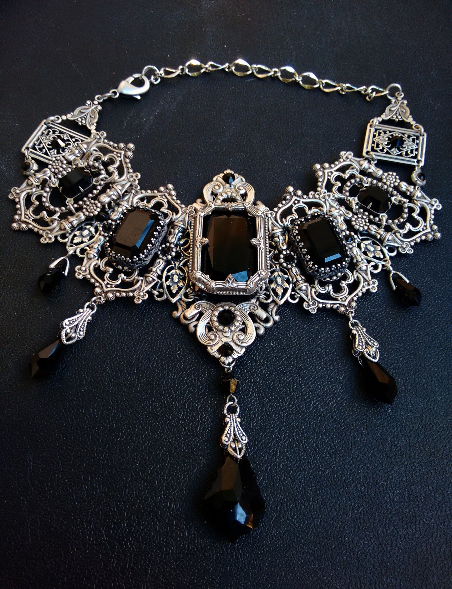Full view of Grand Gothic Choker Set-Silver and Austrian Crystals with black stones and intricate silver Victorian-style design.