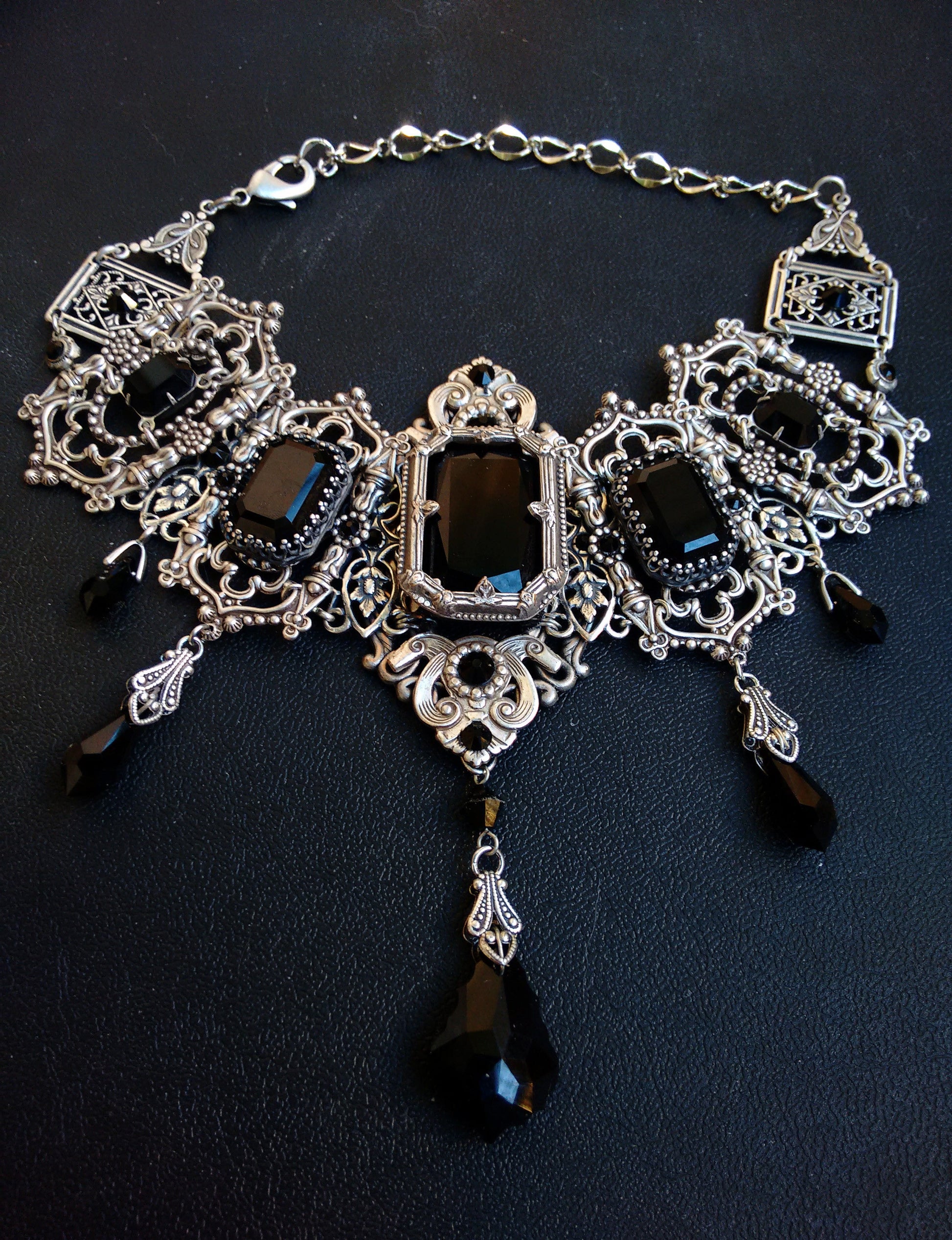 Full view of Grand Gothic Choker Set-Silver and Austrian Crystals with black stones and intricate silver Victorian-style design.