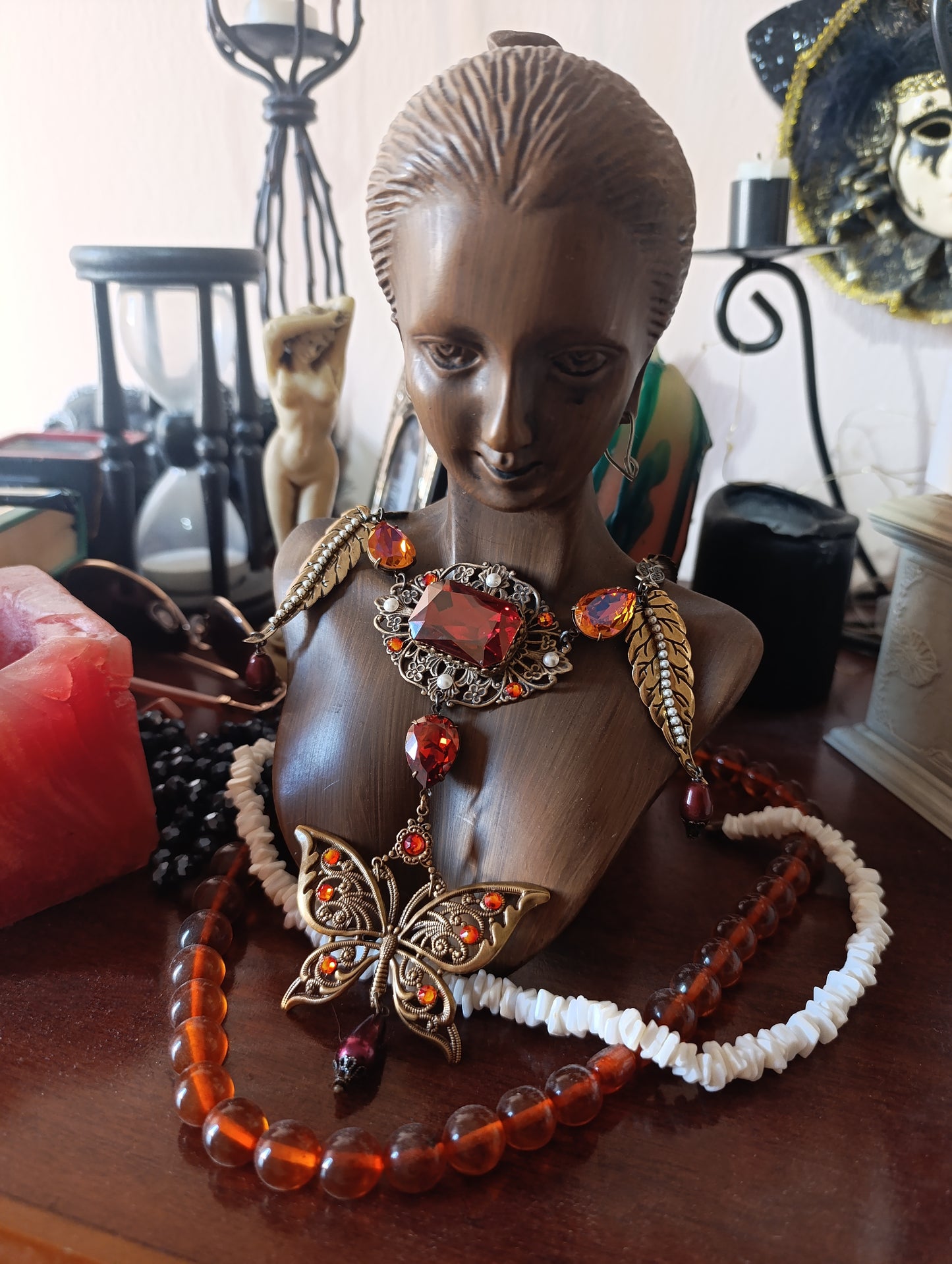 Brass filigree butterfly and red crystals necklace