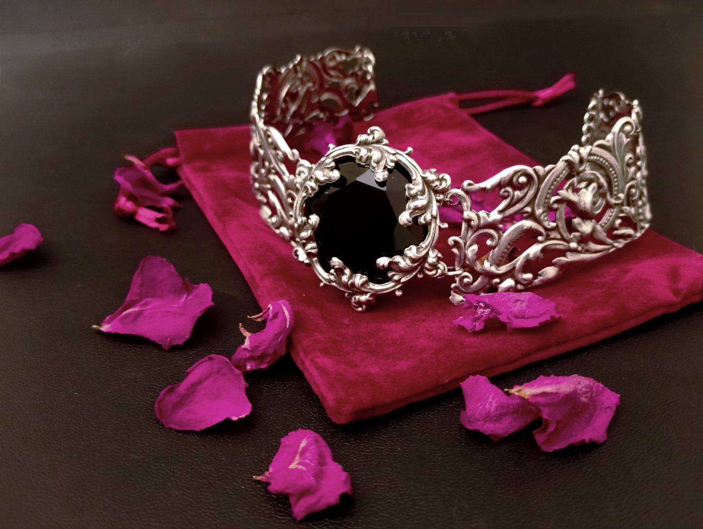 Gothic bridal collar with intricate silver flourishes and a round black crystal jewel.