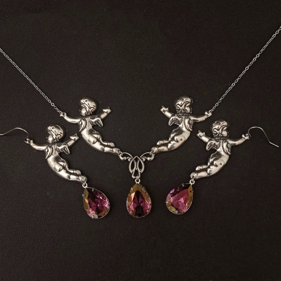 Add a touch of whimsy and elegance to your style with this one of a kind necklace and earrings with cherubs and pink crystals. Victorian vintage style jewelry by Aranwen.